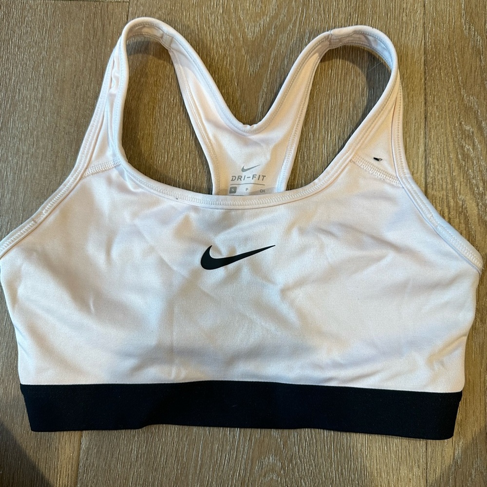 light pink Nike sports bra